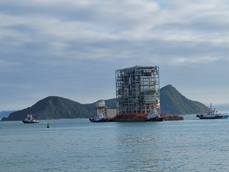 Prefabricated waste-to-energy plant module being transported by sea