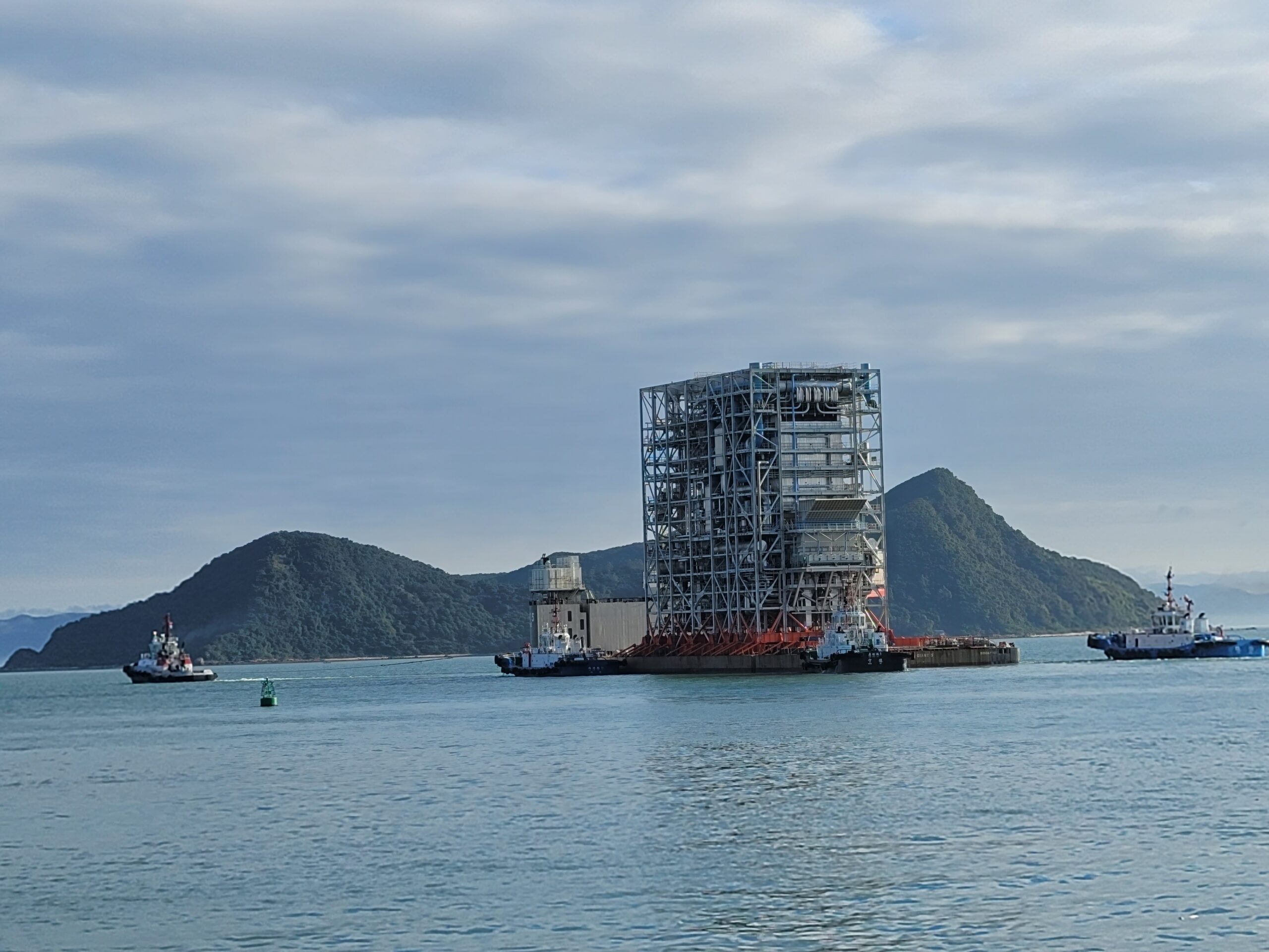 Prefabricated waste-to-energy plant module being transported by sea