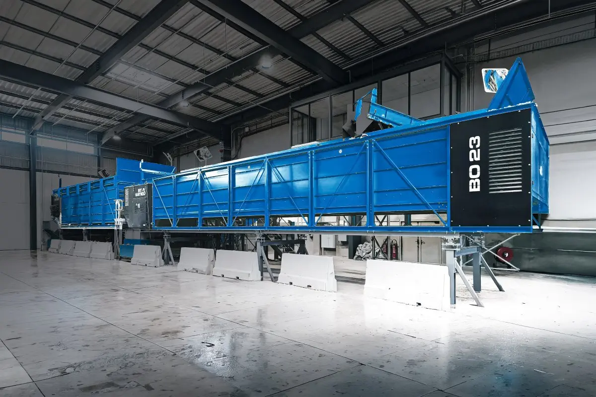 BRT HARTNER bag opener feeding lightweight packaging into a sorting line
